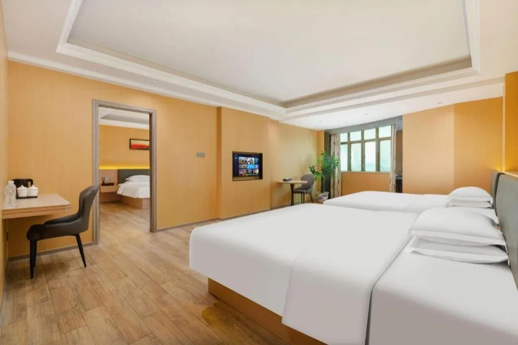 Bed in Borrman Hotel Guangzhou Tianhe Tangdong Subway Station Convention and Exhibition Center