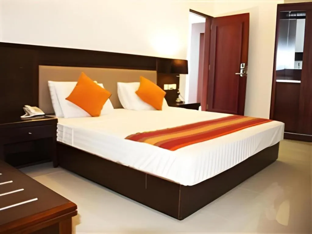 Bed in Sai Sea City Hotel