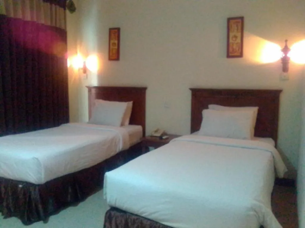 Bed in Yusro Hotel Restaurant & Convention