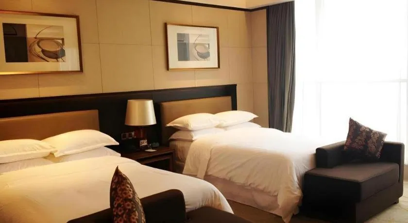 Bed in Chuanghui Business Hotel