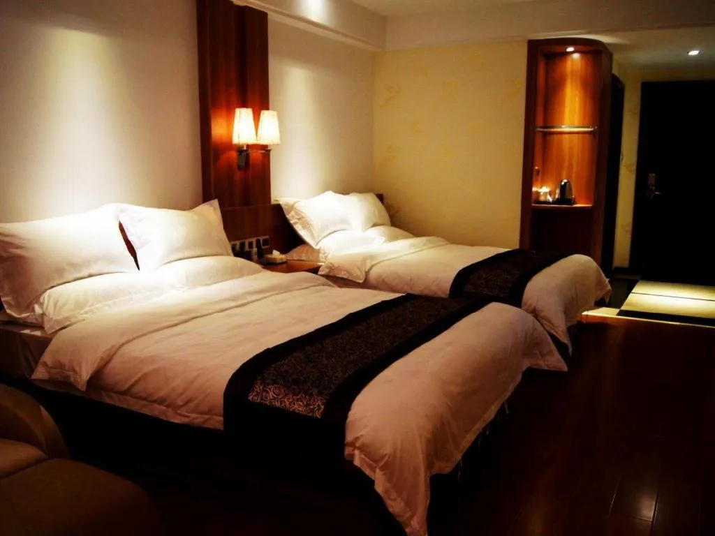 Bed in Chuanghui Business Hotel
