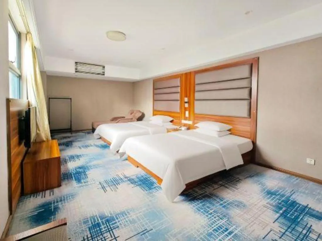 Bed in Chuanghui Business Hotel