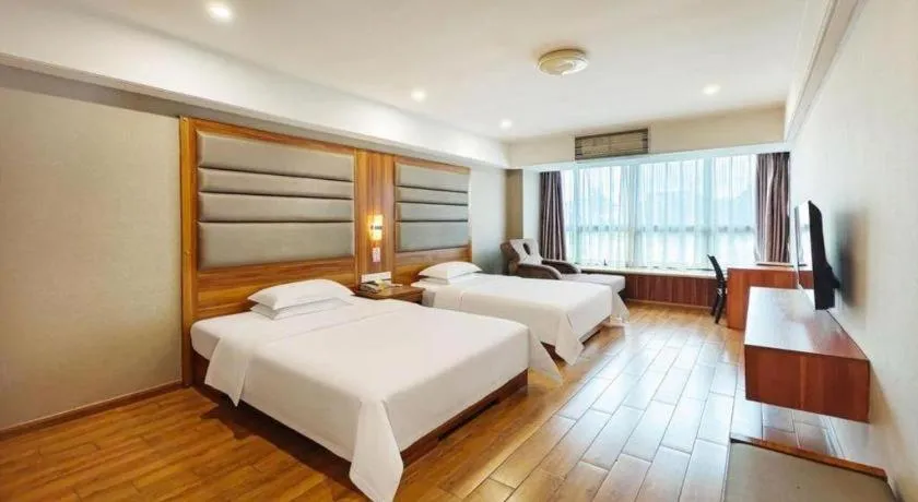Bed in Chuanghui Business Hotel