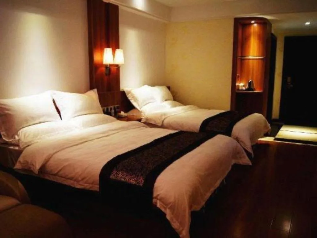 Bed in Chuanghui Business Hotel