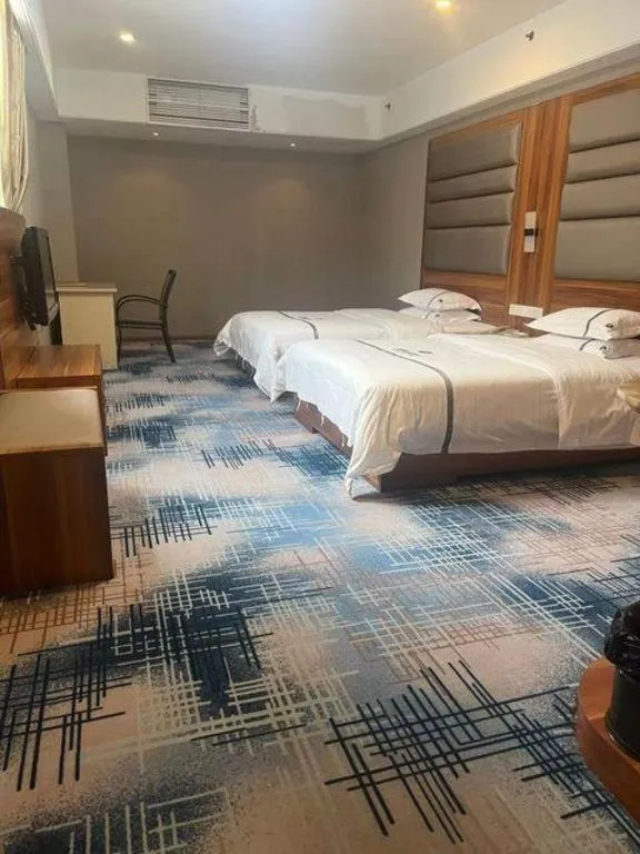Bed in Chuanghui Business Hotel