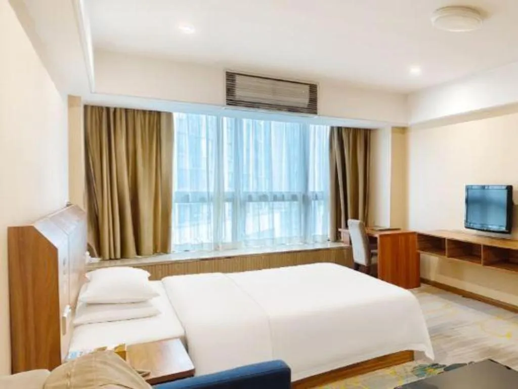 Bed in Chuanghui Business Hotel