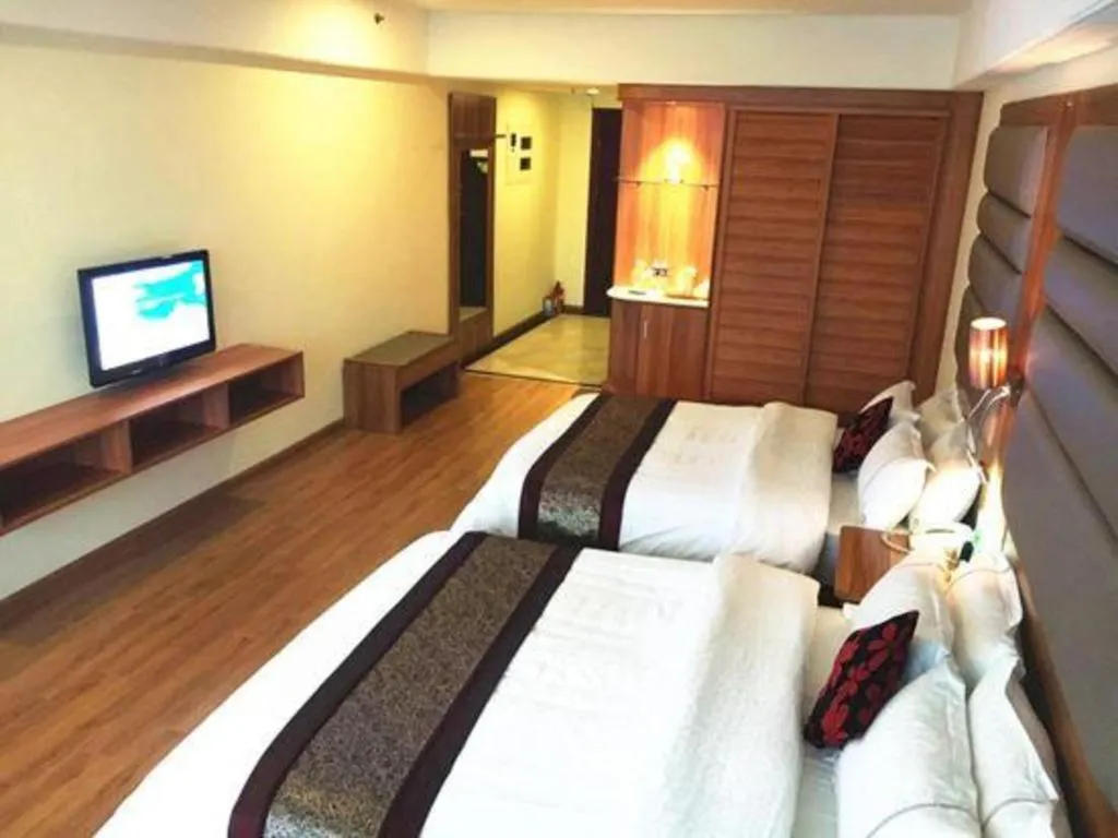 Bed in Chuanghui Business Hotel