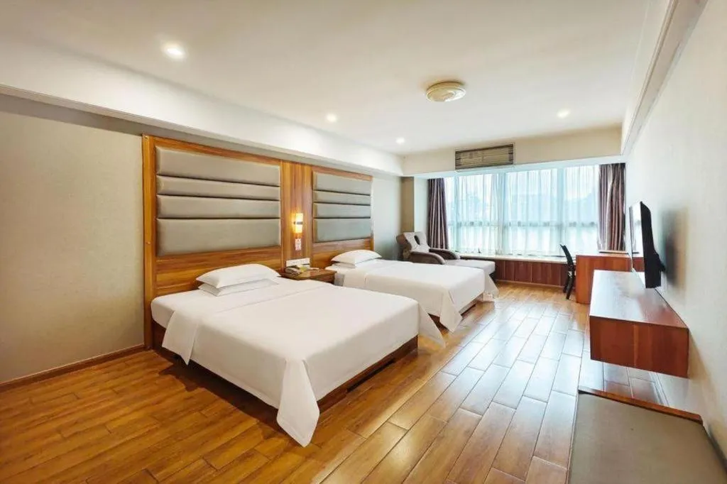 Bed in Chuanghui Business Hotel