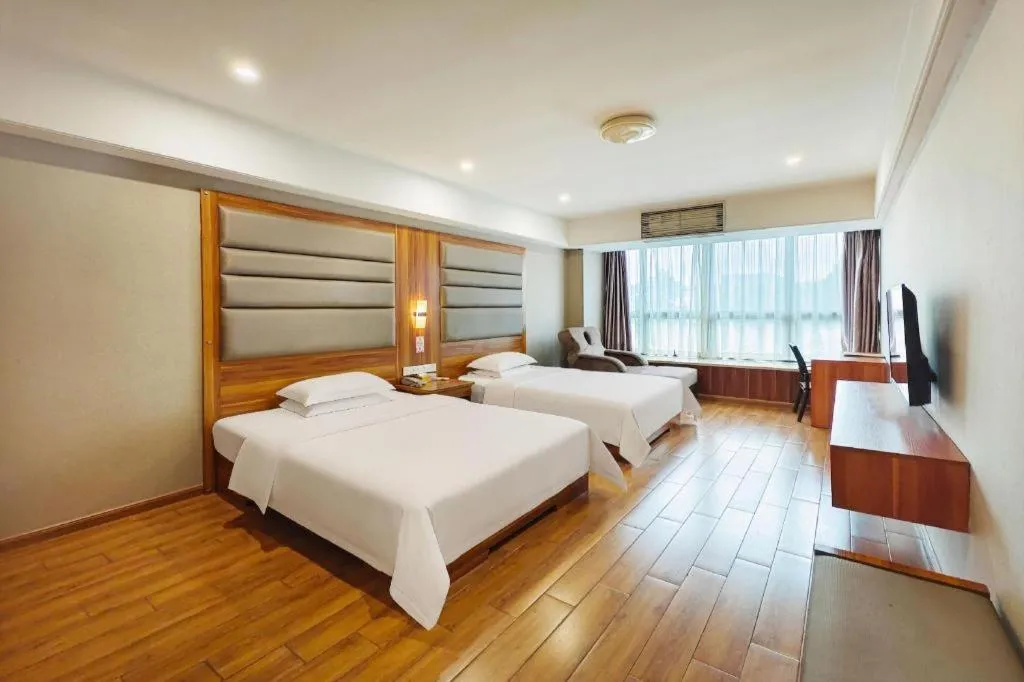 Bed in Chuanghui Business Hotel