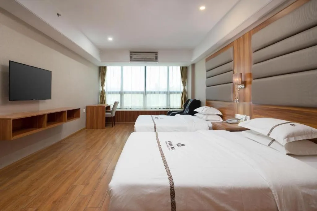 Bed in Chuanghui Business Hotel