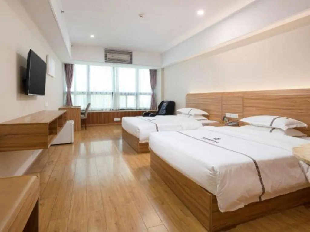 Bed in Chuanghui Business Hotel