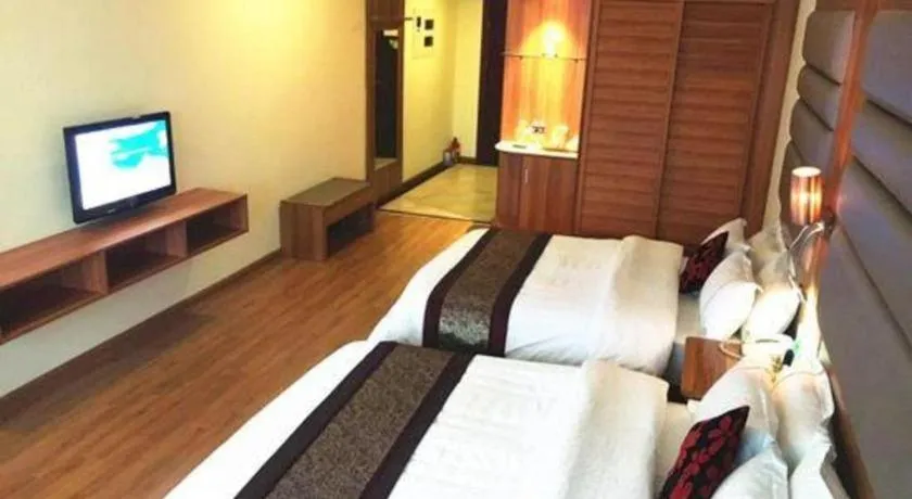 Bed in Chuanghui Business Hotel