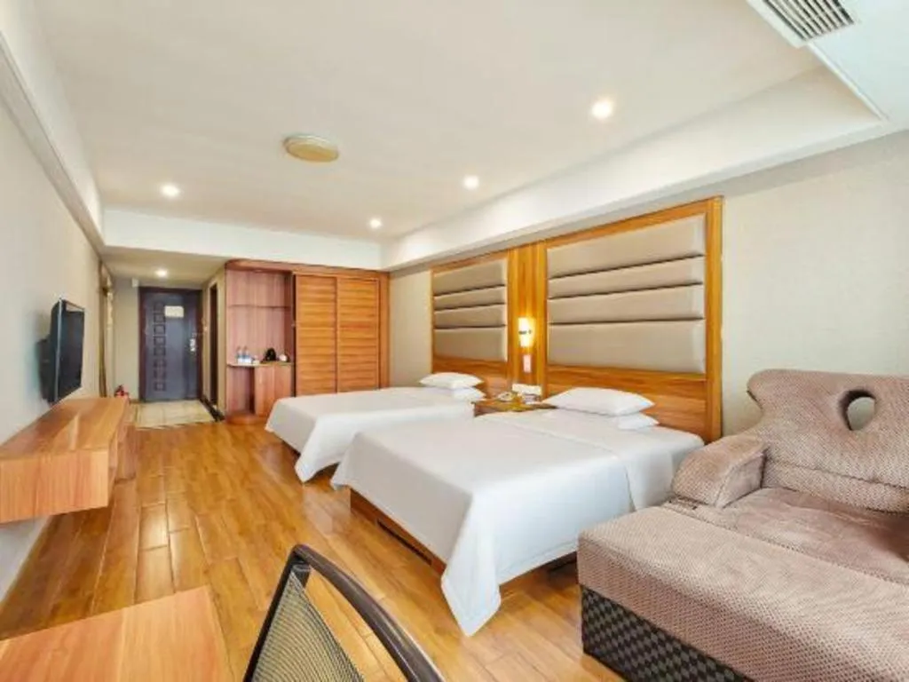 Bed in Chuanghui Business Hotel