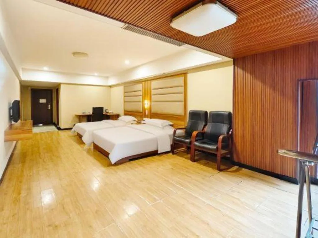 Bed in Chuanghui Business Hotel