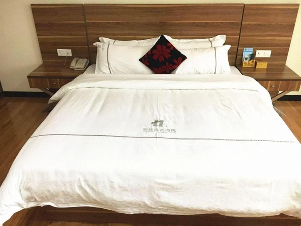 Bed in Chuanghui Business Hotel