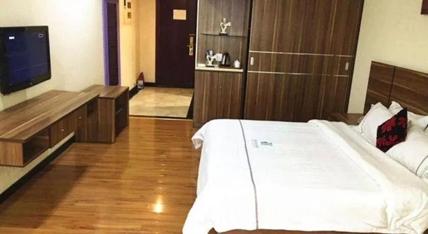 Bed in Chuanghui Business Hotel