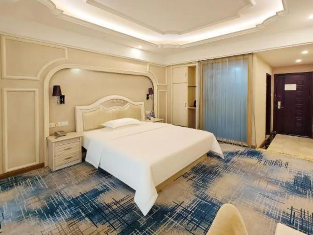 Bed in Chuanghui Business Hotel
