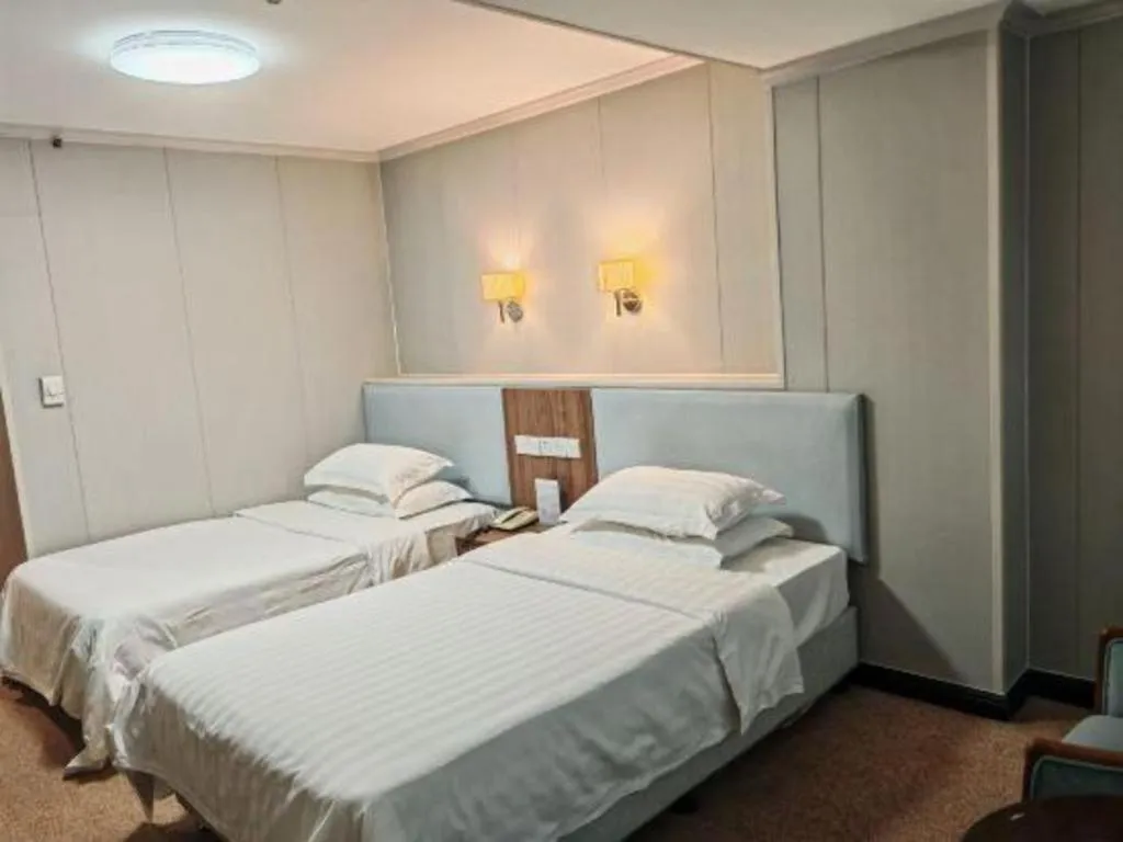 Bed in Dalian Bohai Pearl Hotel