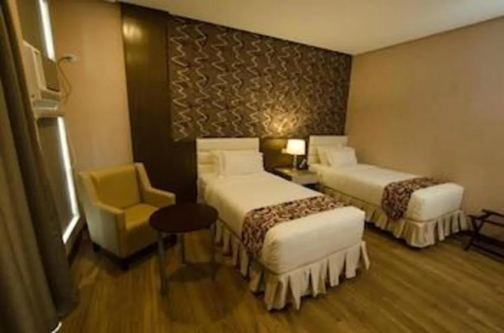 Bed in Oryza Hotel