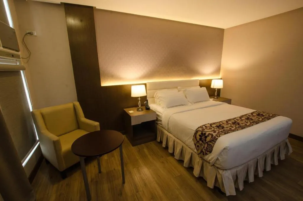 Bed in Oryza Hotel