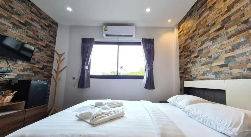 Bed in Rainbow Sky Hotel Samet