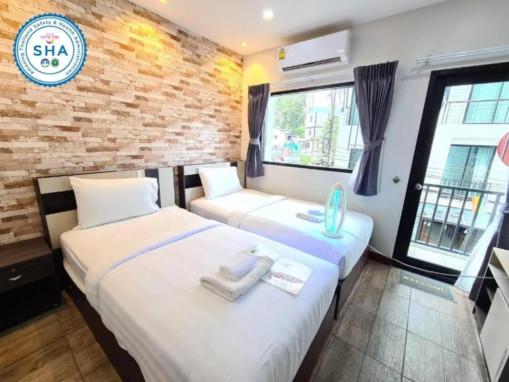 Bed in Rainbow Sky Hotel Samet