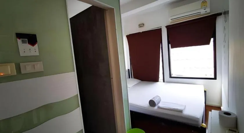 Bed in The Chilli Bangkok Hotel