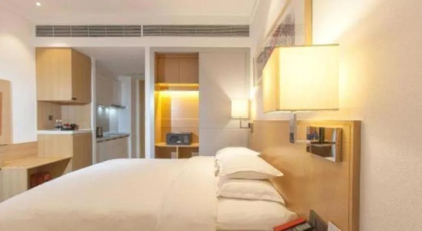 Bed in Ramada Encore by Wyndham Chongqing Yubei