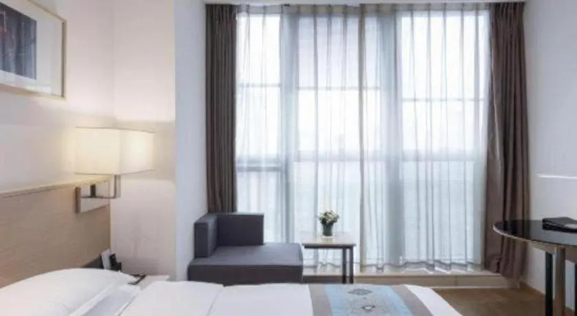 Bed in Ramada Encore by Wyndham Chongqing Yubei