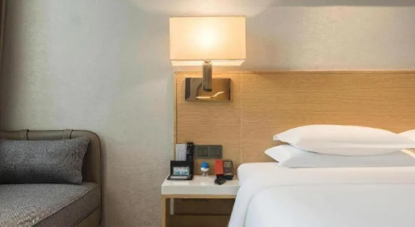 Bed in Ramada Encore by Wyndham Chongqing Yubei