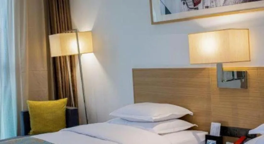 Bed in Ramada Encore by Wyndham Chongqing Yubei