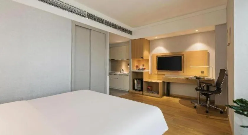 Bed in Ramada Encore by Wyndham Chongqing Yubei