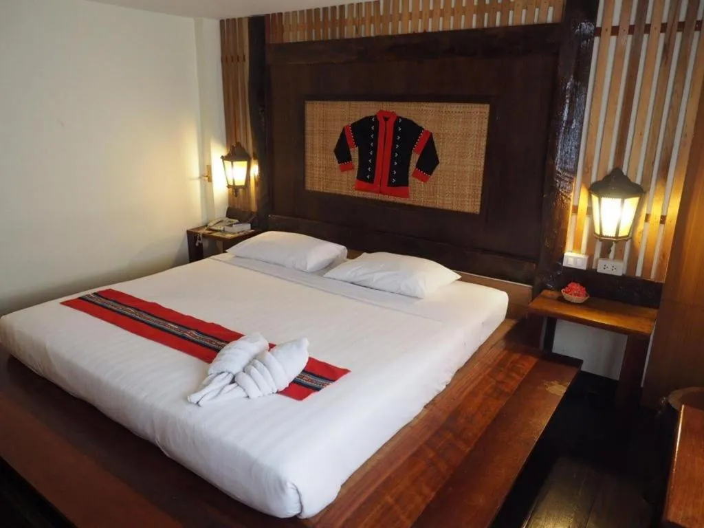 Bed in Phumanee Home Hotel