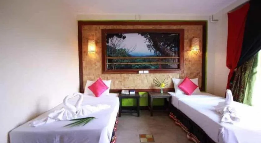 Bed in Phumanee Home Hotel