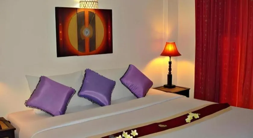 Bed in Phumanee Home Hotel