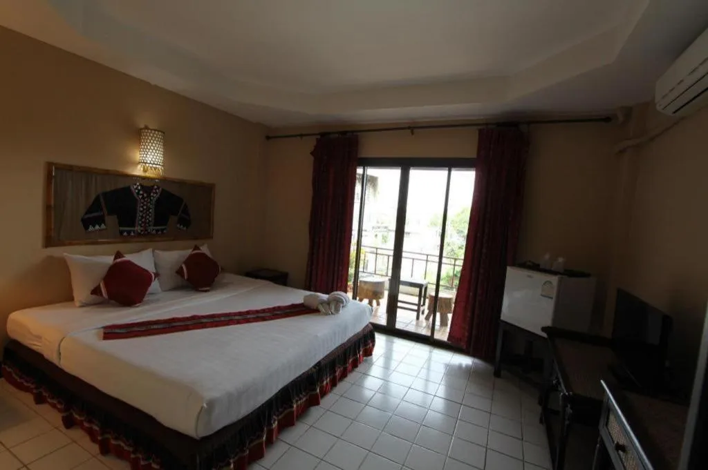 Bed in Phumanee Home Hotel