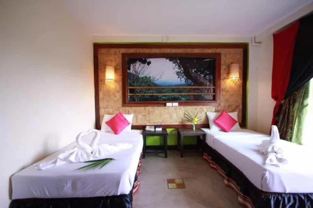 Bed in Phumanee Home Hotel