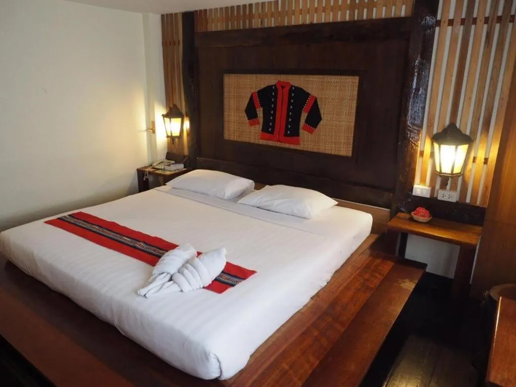 Bed in Phumanee Home Hotel