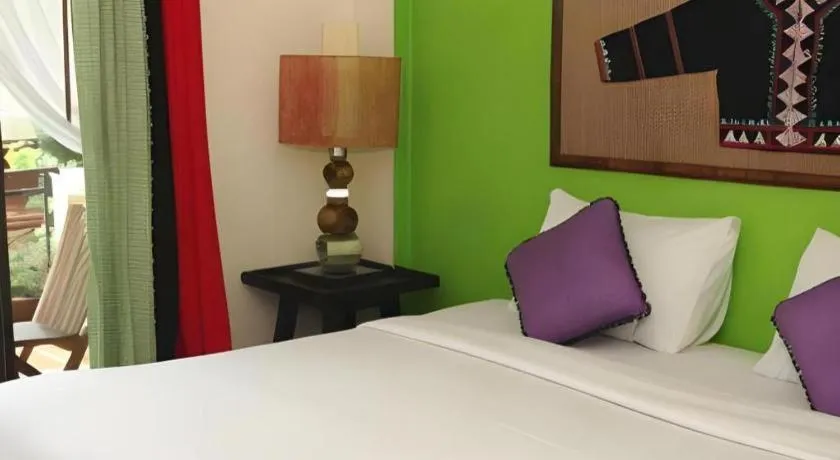 Bed in Phumanee Home Hotel