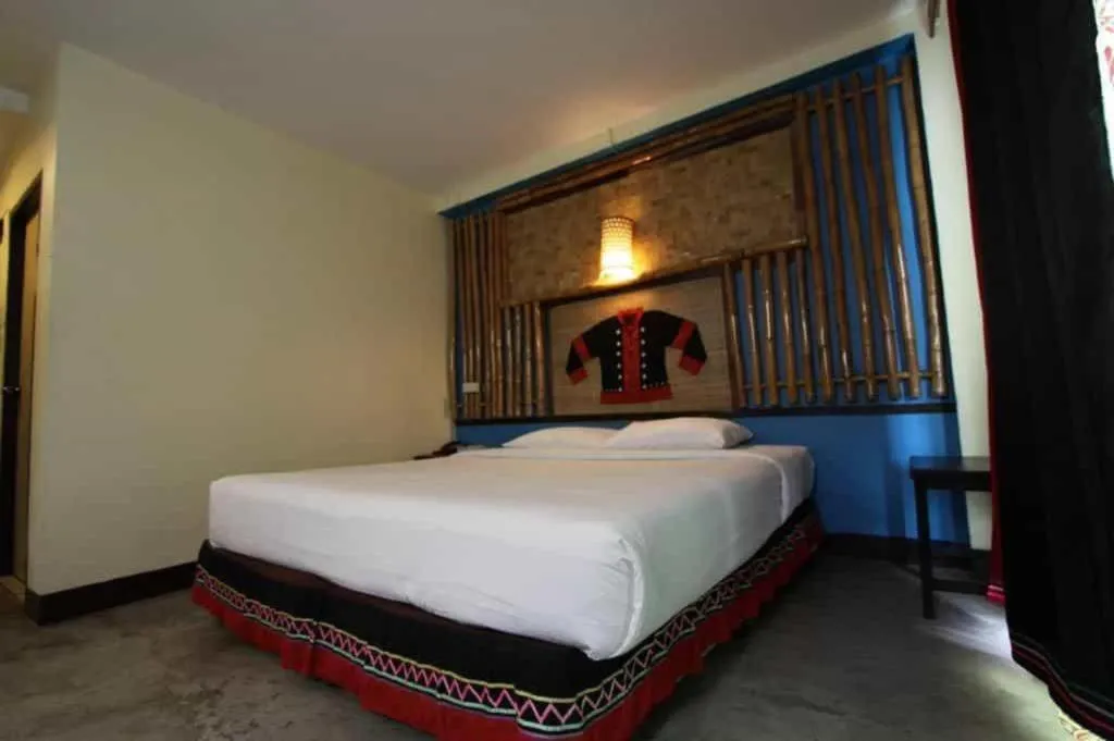 Bed in Phumanee Home Hotel