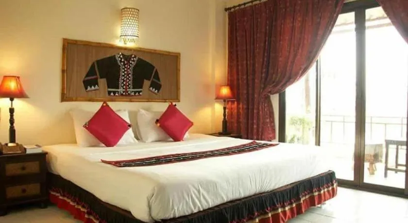 Bed in Phumanee Home Hotel