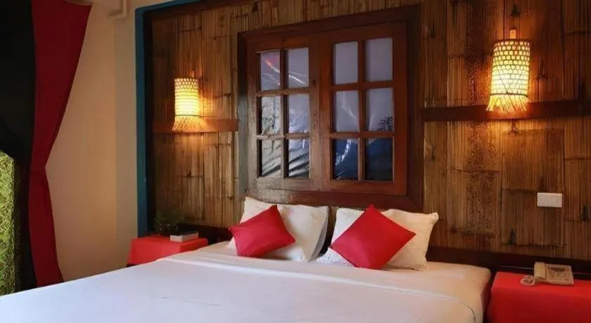 Bed in Phumanee Home Hotel