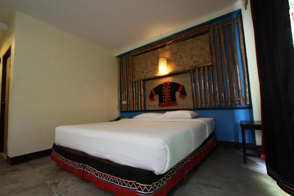 Bed in Phumanee Home Hotel