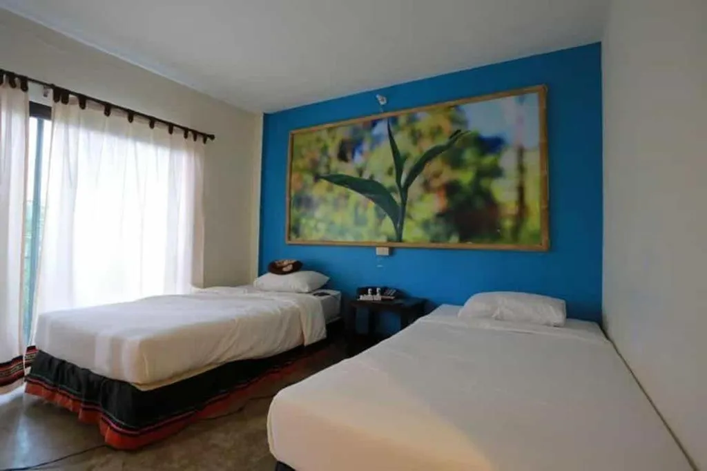 Bed in Phumanee Home Hotel