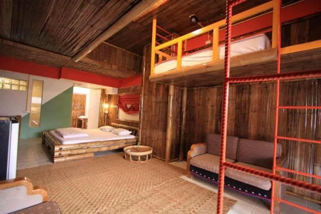 Bed in Phumanee Home Hotel