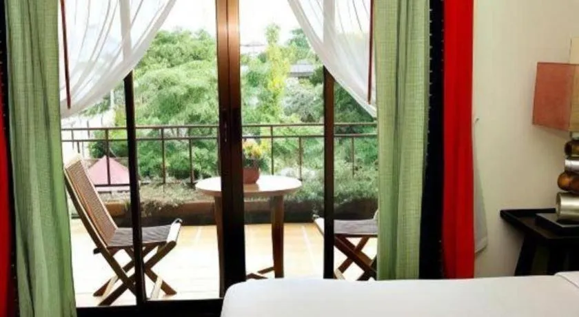 Bed in Phumanee Home Hotel