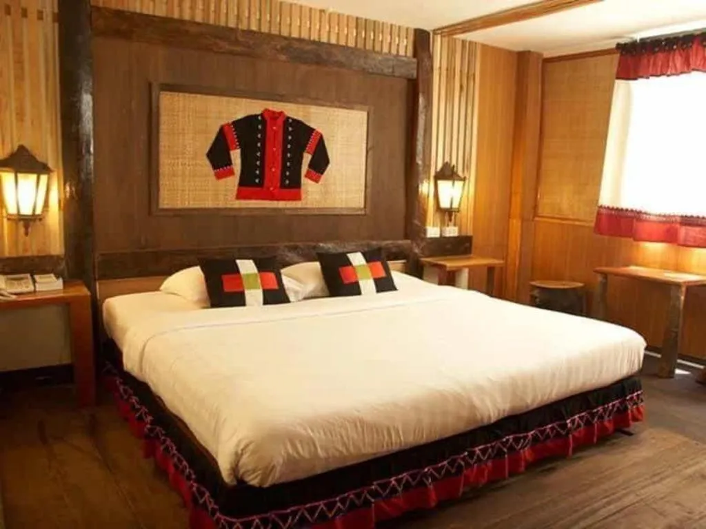 Bed in Phumanee Home Hotel