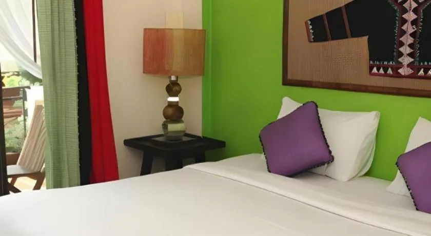 Bed in Phumanee Home Hotel