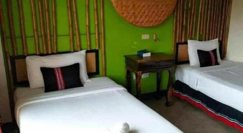 Bed in Phumanee Home Hotel