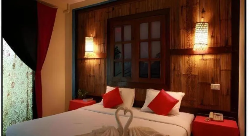 Bed in Phumanee Home Hotel